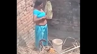 My Neighbour aunty Bathing showing her big boobs.