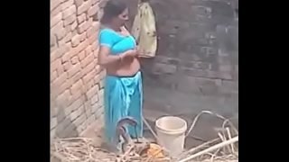 My Neighbour aunty Bathing showing her big boobs.